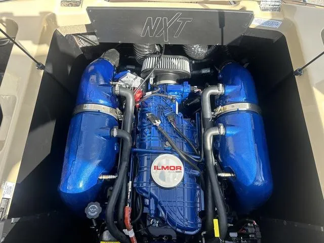 Slide: The Image of 2024 MasterCraft NXT21 engine with blue Ilmor components. - 41