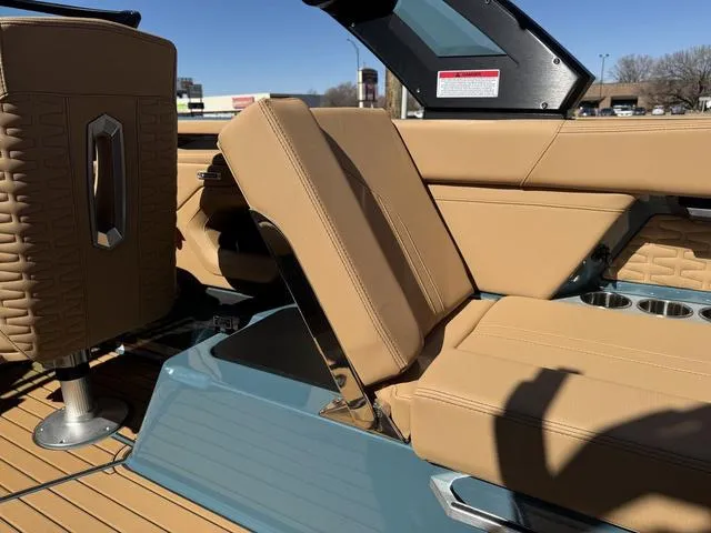 Slide: The Image of 2025 MasterCraft X24 boat interior with tan leather seats and modern design elements. - 17