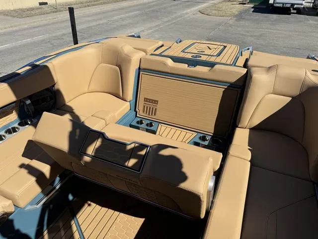 Slide: The Image of 2025 MasterCraft X24 boat interior with tan leather seating and modern design. - 21