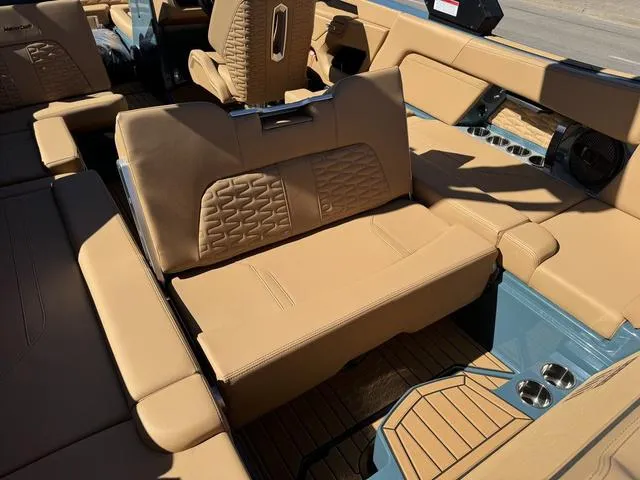 Slide: The Image of 2025 MasterCraft X24 interior with tan leather seating and modern design elements. - 22