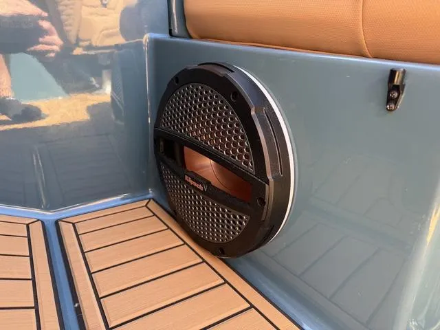 Slide: The Image of Speaker on 2025 MasterCraft X24 boat with teak flooring and blue paneling. - 27