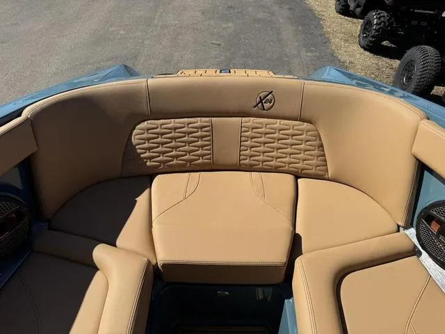 Slide: The Image of 2025 MasterCraft X24 boat interior with tan leather seating and stylish design. - 35