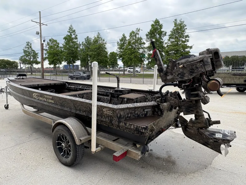 Slide: The Image of 2024 Pro-Drive X-Series TD Edition boat on trailer, featuring a powerful outboard motor. - 3