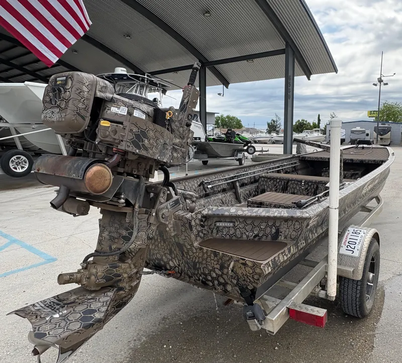 Slide: The Image of 2024 Pro-Drive X-Series TD Edition boat with camouflage design on a trailer. - 4