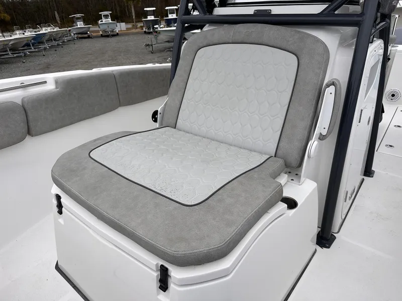 Slide: The Image of 2021 Sea Fox 288 Commander boat seat with gray upholstery and storage compartment. - 13
