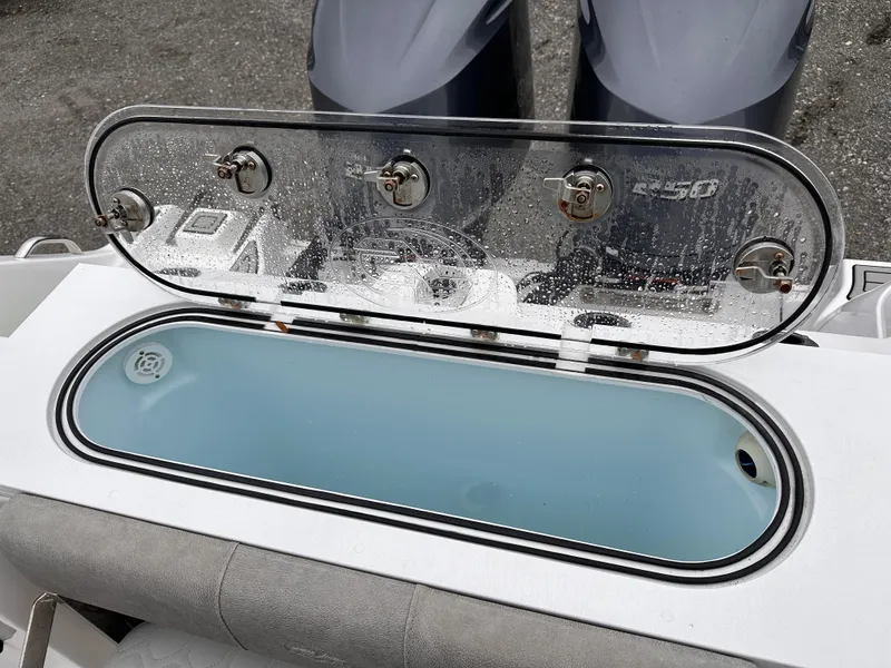 Slide: The Image of Livewell on 2021 Sea Fox 288 Commander boat, open lid, dual engines visible. - 16