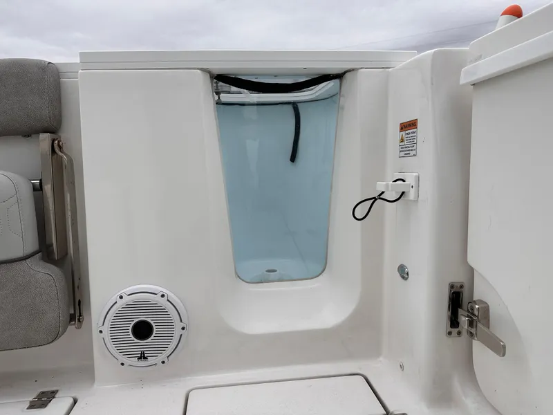 Slide: The Image of 2021 Sea Fox 288 Commander boat interior with seating, speaker, and storage compartment. - 19