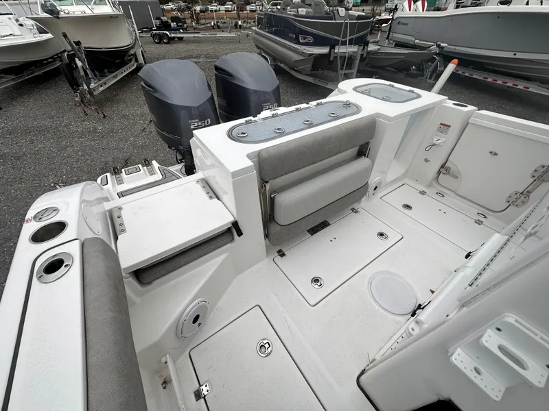 Slide: The Image of 2021 Sea Fox 288 Commander boat interior with dual engines and seating area. - 20