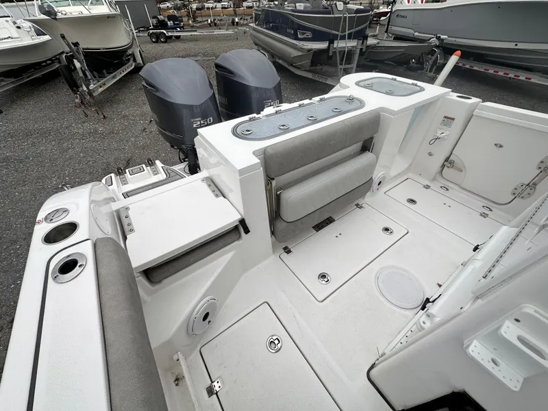 Slide: The Image of 2021 Sea Fox 288 Commander boat interior with dual engines and seating. - 21