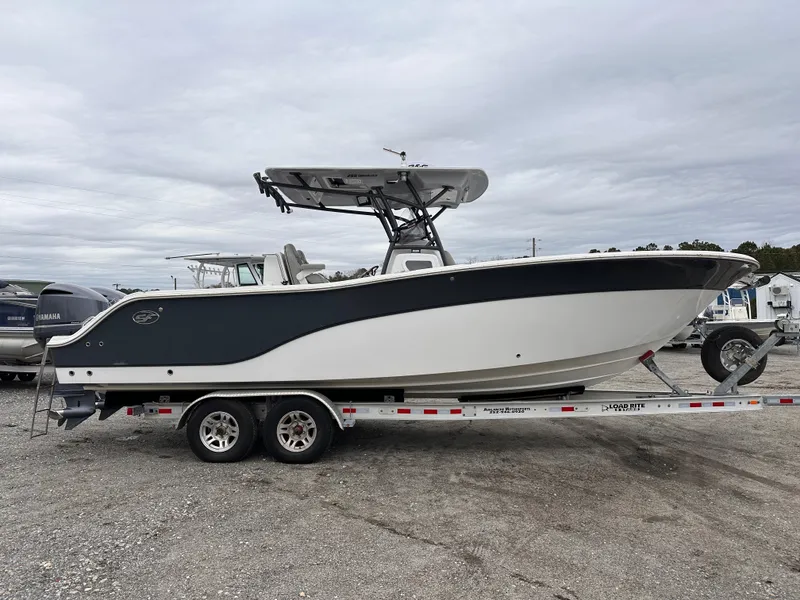 Slide: The Image of 2021 Sea Fox 288 Commander boat on trailer, side view, overcast sky. - 3
