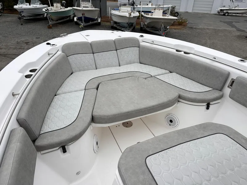 Slide: The Image of 2021 Sea Fox 288 Commander boat with spacious gray seating area. - 7
