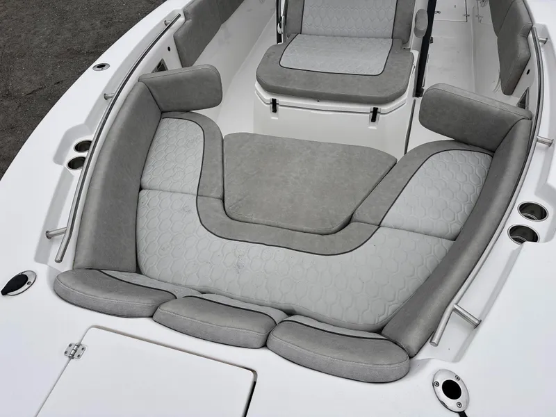 Slide: The Image of 2021 Sea Fox 288 Commander boat interior with cushioned seating and cup holders. - 8