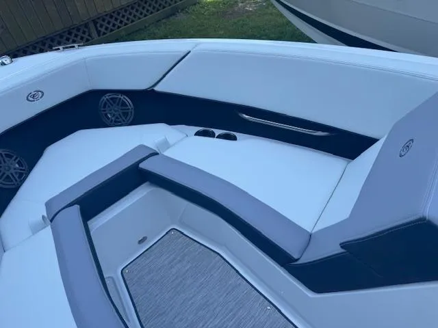 Slide: The Image of 2025 Cobalt CS22 boat interior with sleek white and gray seating. - 13