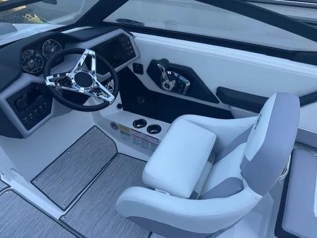 Slide: The Image of 2025 Cobalt CS22 boat interior with modern steering wheel and dashboard controls. - 19