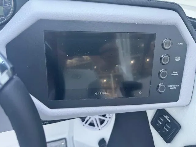 Slide: The Image of Dashboard of 2025 Cobalt CS22 boat with Garmin display and control buttons. - 21