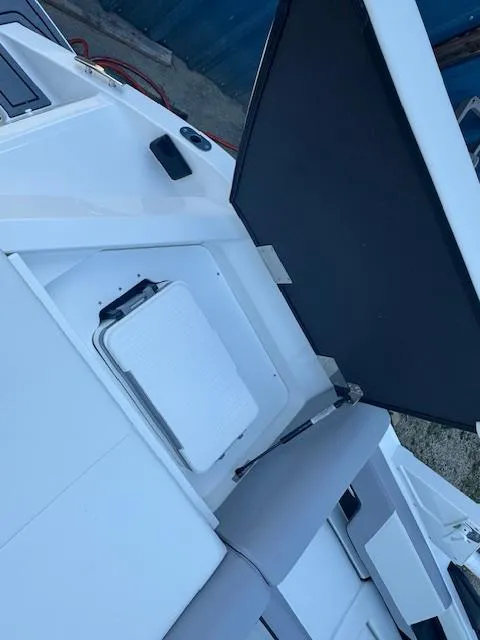 Slide: The Image of 2025 Cobalt CS22 boat interior with seating and storage compartments. - 27