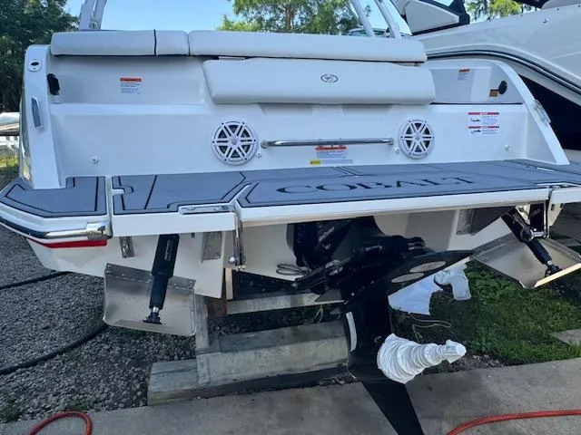Slide: The Image of 2025 Cobalt CS22 boat rear view with swim platform and dual speakers. - 28