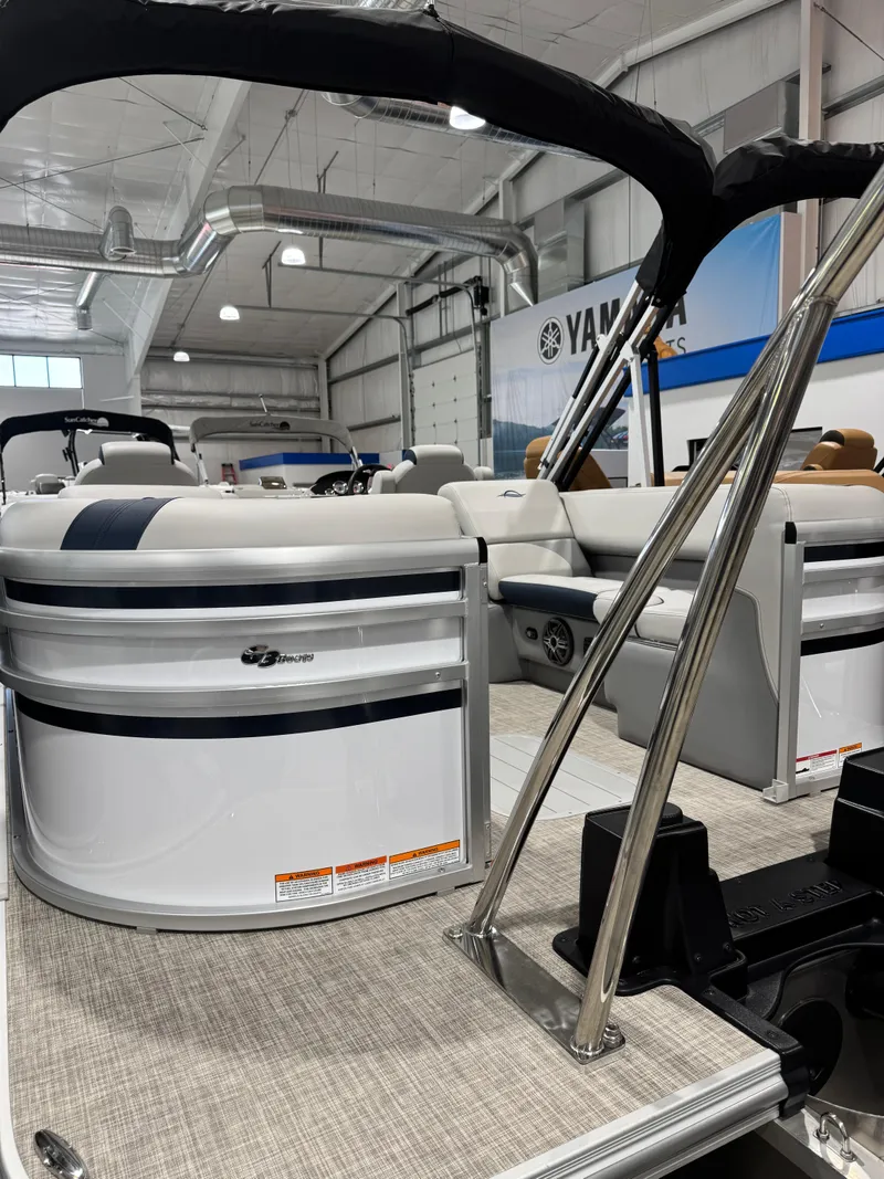 Slide: The Image of 2025 G3 Select 322RC pontoon boat displayed in a showroom. - 1