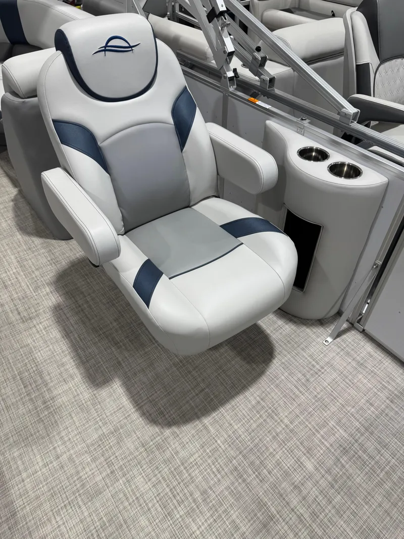 Slide: The Image of 2025 G3 Select 322RC boat seat with cup holders, featuring gray and blue upholstery. - 11