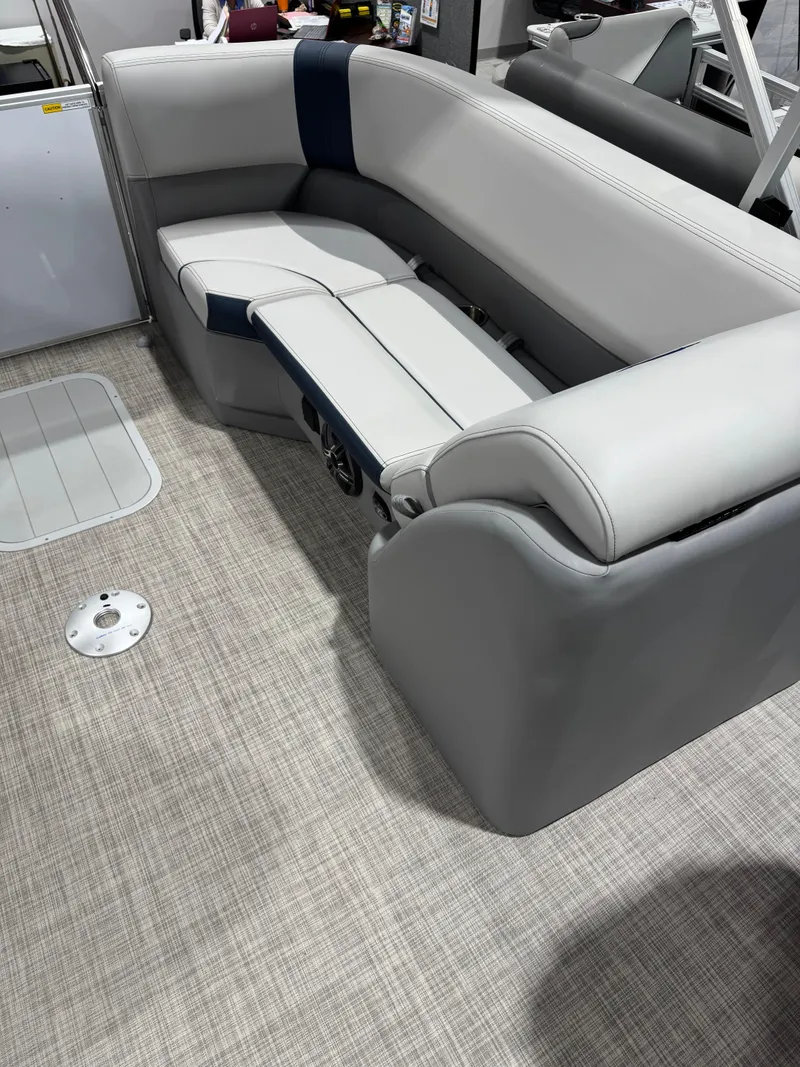Slide: The Image of 2025 G3 Select 322RC boat interior with gray seating and carpeted flooring. - 13