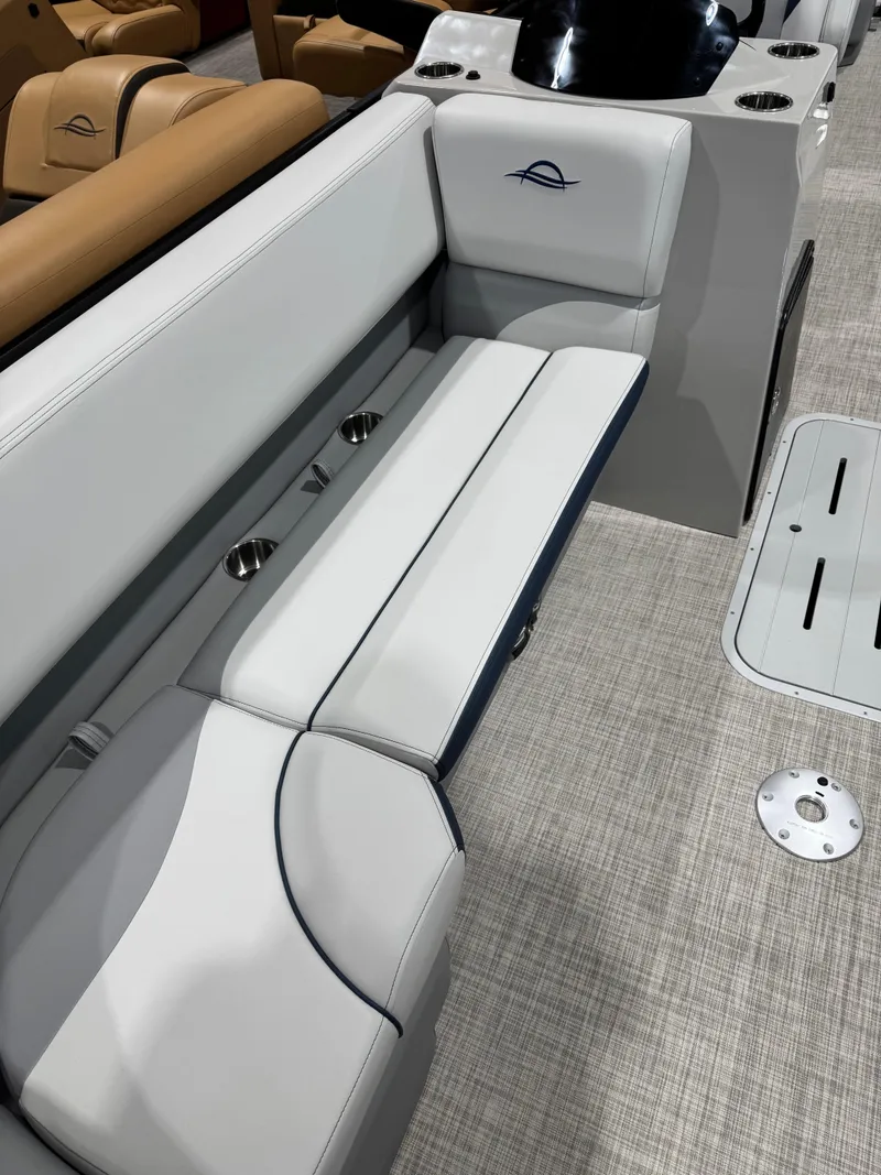 Slide: The Image of 2025 G3 Select 322RC boat interior with white cushioned seating and modern design. - 4