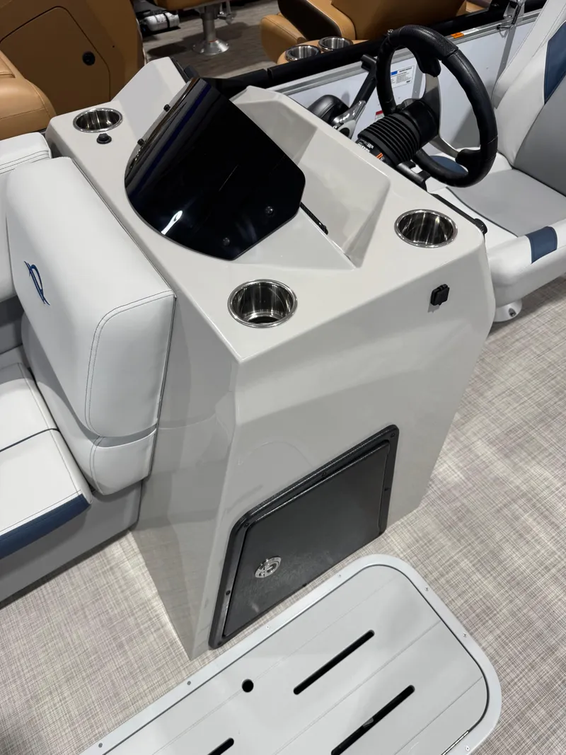 Slide: The Image of 2025 G3 Select 322RC boat console with steering wheel and cup holders. - 7