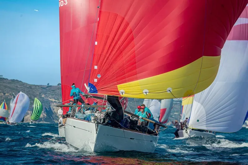 Slide: The Image of Sailing race featuring a 2001 Beneteau First 47.7 with vibrant red and yellow spinnaker. - 21