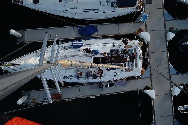 Slide: The Image of Overhead view of a 2001 Beneteau First 47.7 sailboat docked at a marina. - 3