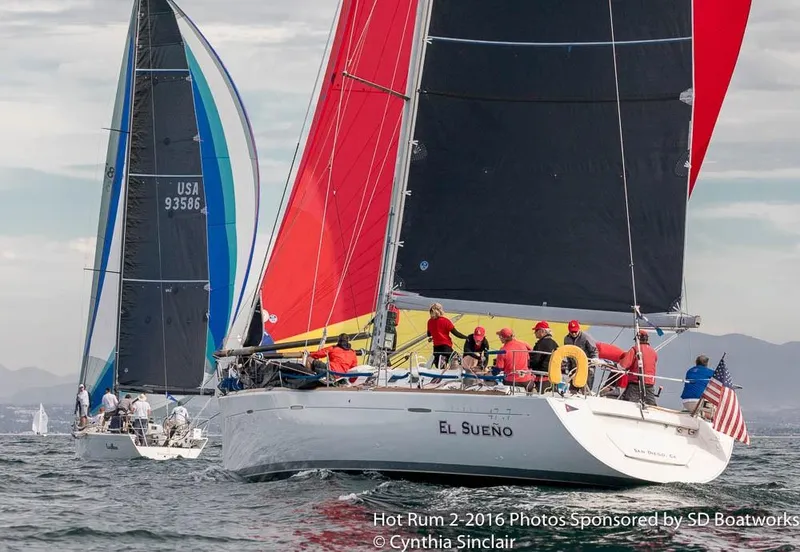 Slide: The Image of Sailboats racing on the ocean, featuring a 2001 Beneteau First 47.7 with vibrant sails. - 4