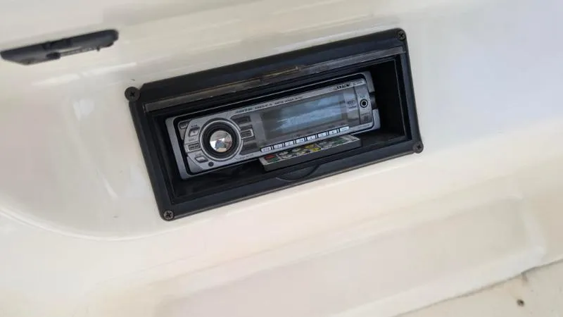 Slide: The Image of 1997 Sea Ray 215 Express Cruiser stereo system installed in dashboard. - 8