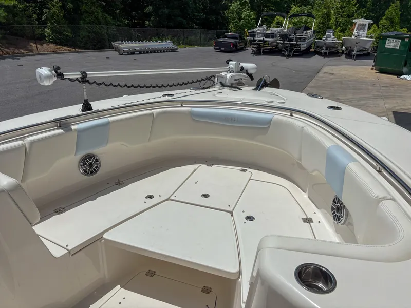 Slide: The Image of 2023 Robalo R302 boat interior with spacious seating and modern design. - 12