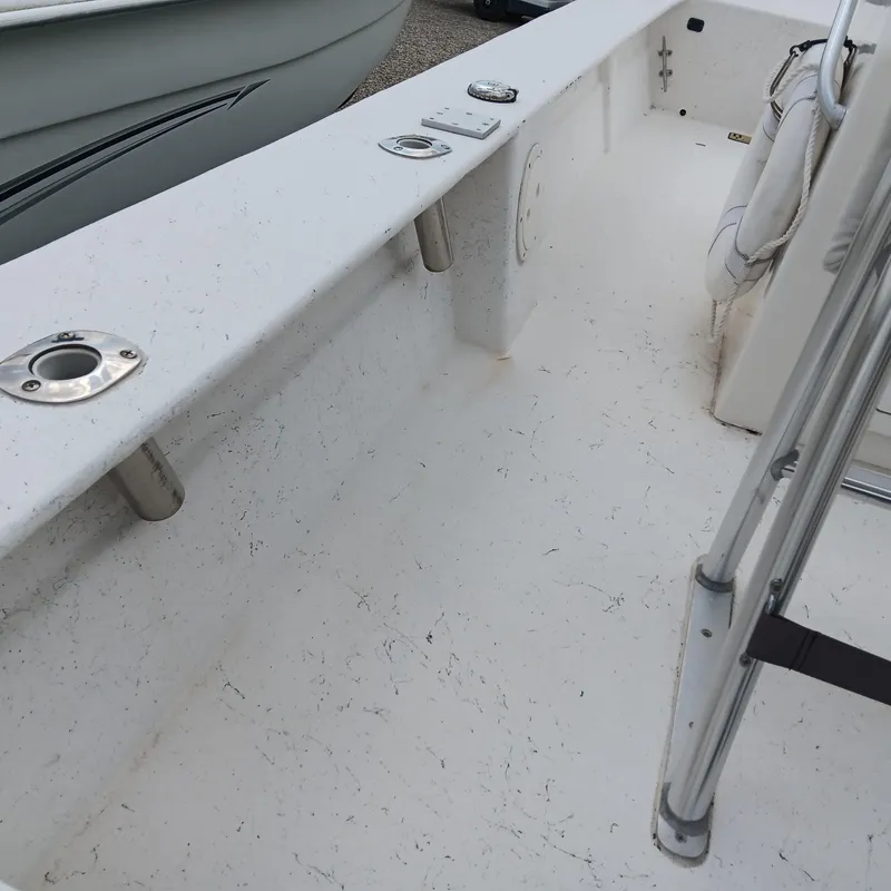 Slide: The Image of 2020 May-Craft 19 Cape Classic boat interior with rod holders and clean deck. - 12