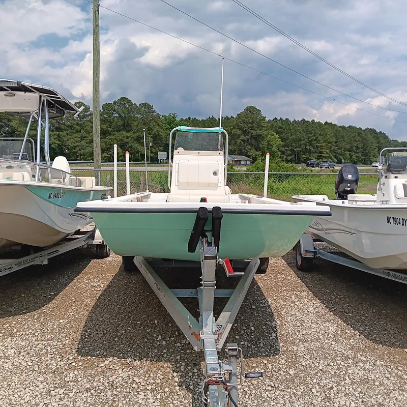 Slide: The Image of 2020 May-Craft 19 Cape Classic boat on trailer, parked outdoors under cloudy sky. - 3