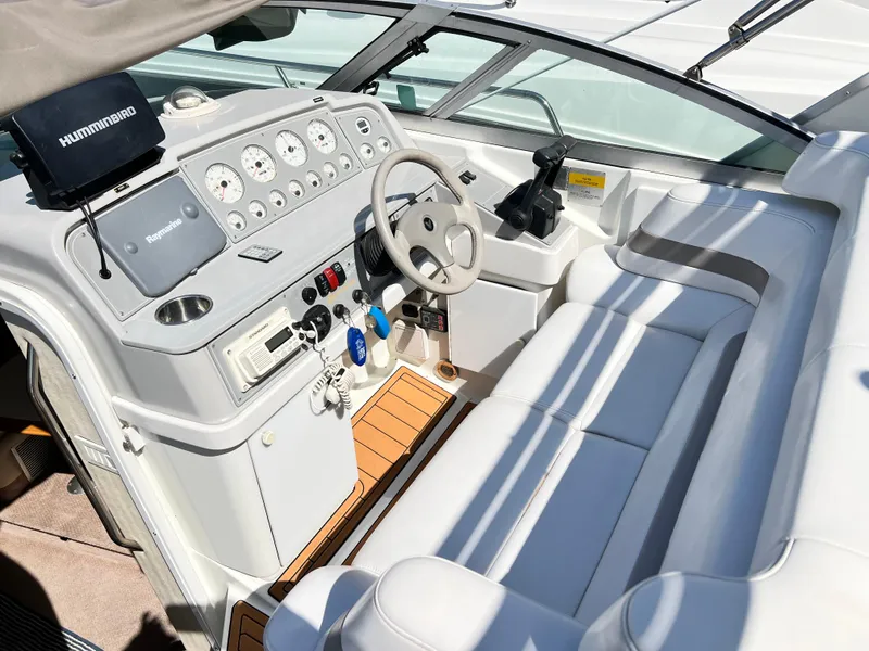 Slide: The Image of 1999 Formula 31 PC boat cockpit with steering wheel and control panel. - 8