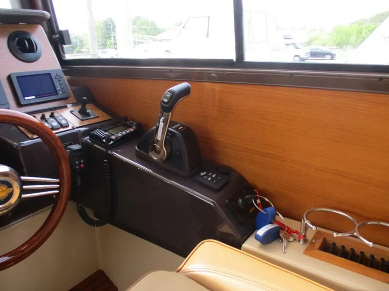 Slide: The Image of Interior helm of 2020 Ranger Tugs R-27 LE with control panel and throttle. - 10