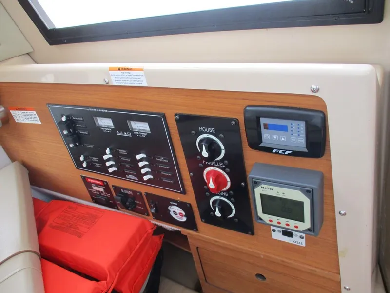 Slide: The Image of Control panel of 2020 Ranger Tugs R-27 LE with safety equipment and electronic displays. - 5