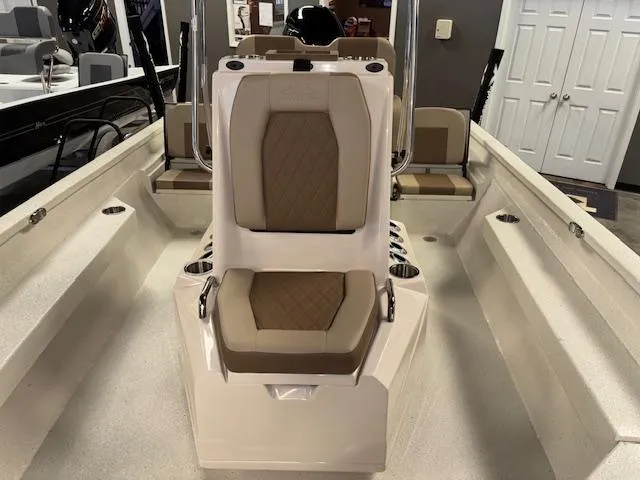 Slide: The Image of 2025 Xpress H22 Bay boat interior with cushioned seating and modern design. - 17