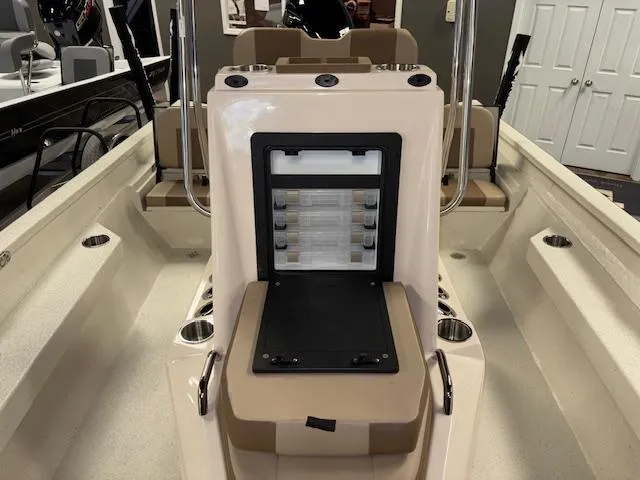 Slide: The Image of 2025 Xpress H22 Bay boat interior with storage compartment and seating. - 18