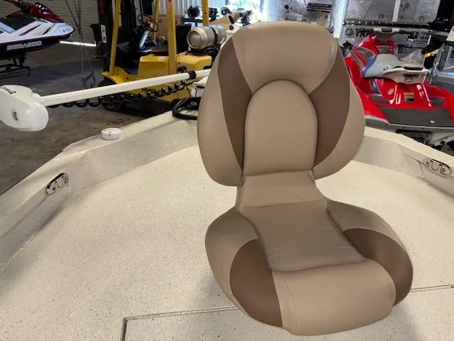 Slide: The Image of 2025 Xpress H22 Bay boat with a beige and brown captain's chair. - 21