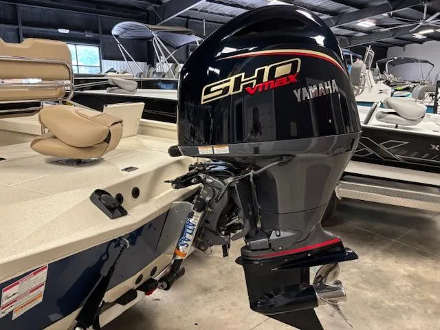 Slide: The Image of 2025 Xpress H22 Bay boat with Yamaha SHO VMAX engine in showroom. - 6