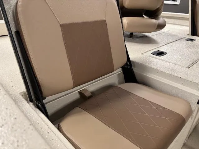 Slide: The Image of 2025 Xpress H22 Bay boat seat with beige and brown upholstery. - 9