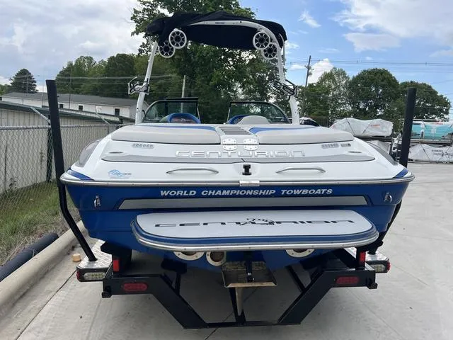 Slide: The Image of 2014 Centurion Enzo SS210 boat, rear view, on trailer, with "World Championship Towboats" branding. - 11
