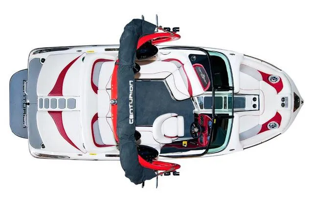 Slide: The Image of 2014 Centurion Enzo SS210 boat, top view, featuring red and white design with seating and controls. - 4