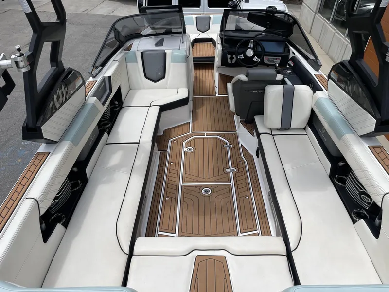 Slide: The Image of 2019 Nautique Super Air Nautique G25 interior with luxurious seating and sleek design. - 5