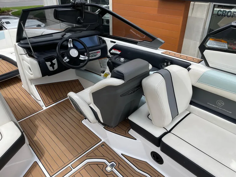 Slide: The Image of 2019 Nautique Super Air Nautique G25 interior with sleek dashboard and luxurious seating. - 7
