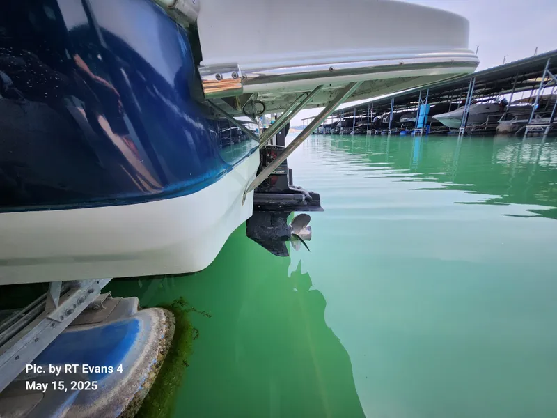 Slide: The Image of 2008 Caravelle 206LS Bow Rider boat docked in calm green water. - 6