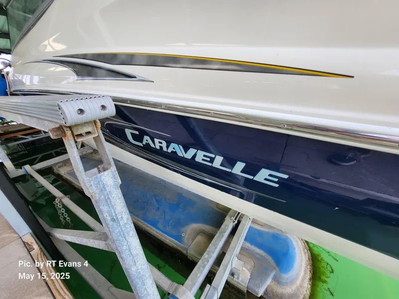 Slide: The Image of 2008 Caravelle 206LS Bow Rider boat on trailer, side view with logo visible. - 7