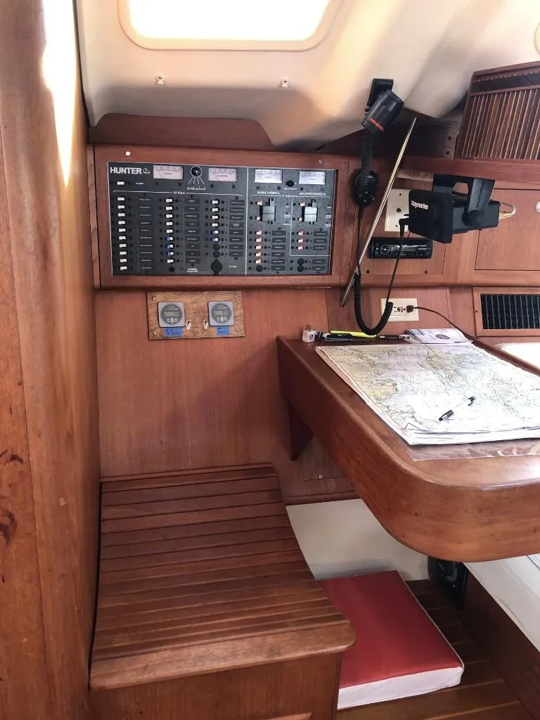 Slide: The Image of Interior of 2001 Hunter 410 sailboat with navigation station and control panel. - 20