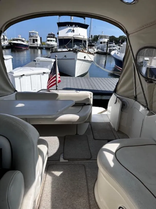 Slide: The Image of Interior view of a 2000 Sea Ray 270 Sundancer at a marina. - 14