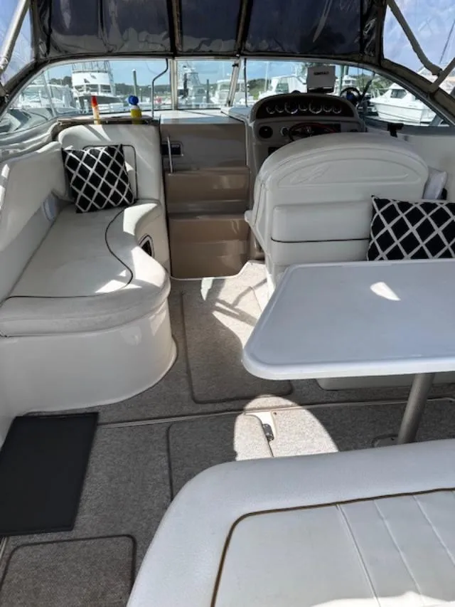 Slide: The Image of Interior of a 2000 Sea Ray 270 Sundancer boat with seating and table. - 18